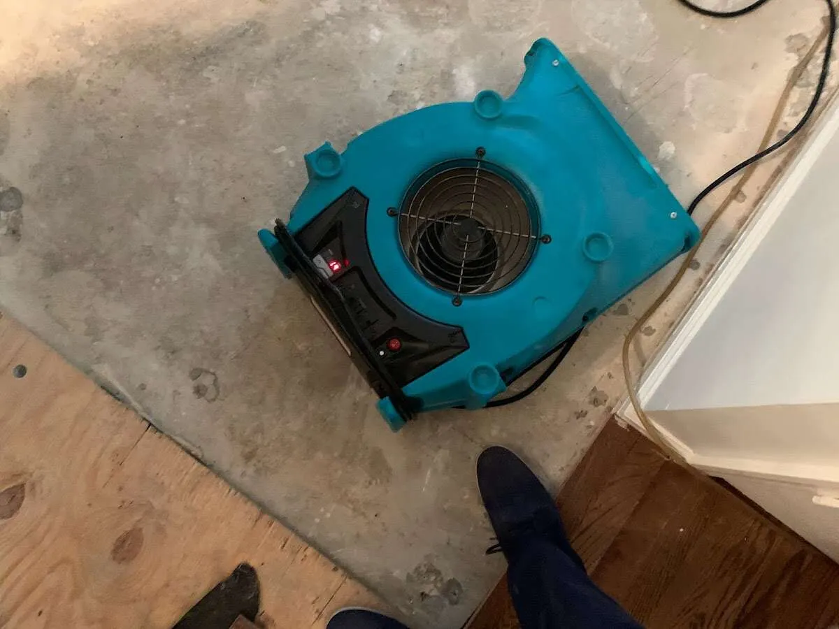 Air mover drying subfloor during Leak Detection & Repair in Nappanee